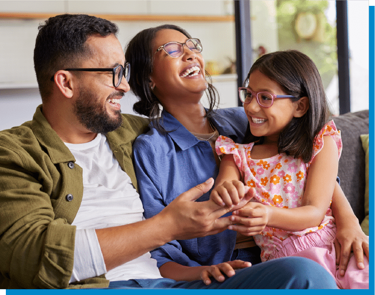 a group of people sitting and looking at the camera