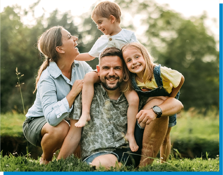 a couple of people that are standing in the grass