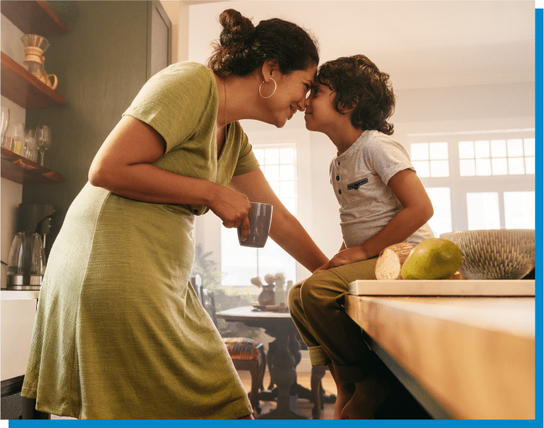 a man and woman preparing food in a kitchen