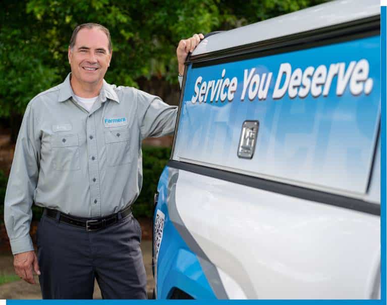 Servicer member in front of truck with logo Service You Deserve